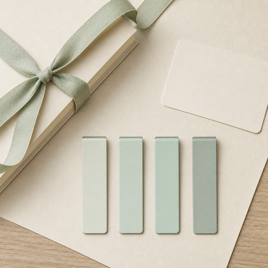 Four sage magnetic page markers arranged as a book lover gift