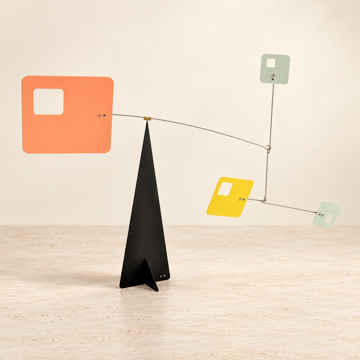 Square geometric balance sculpture in peach, sage and yellow