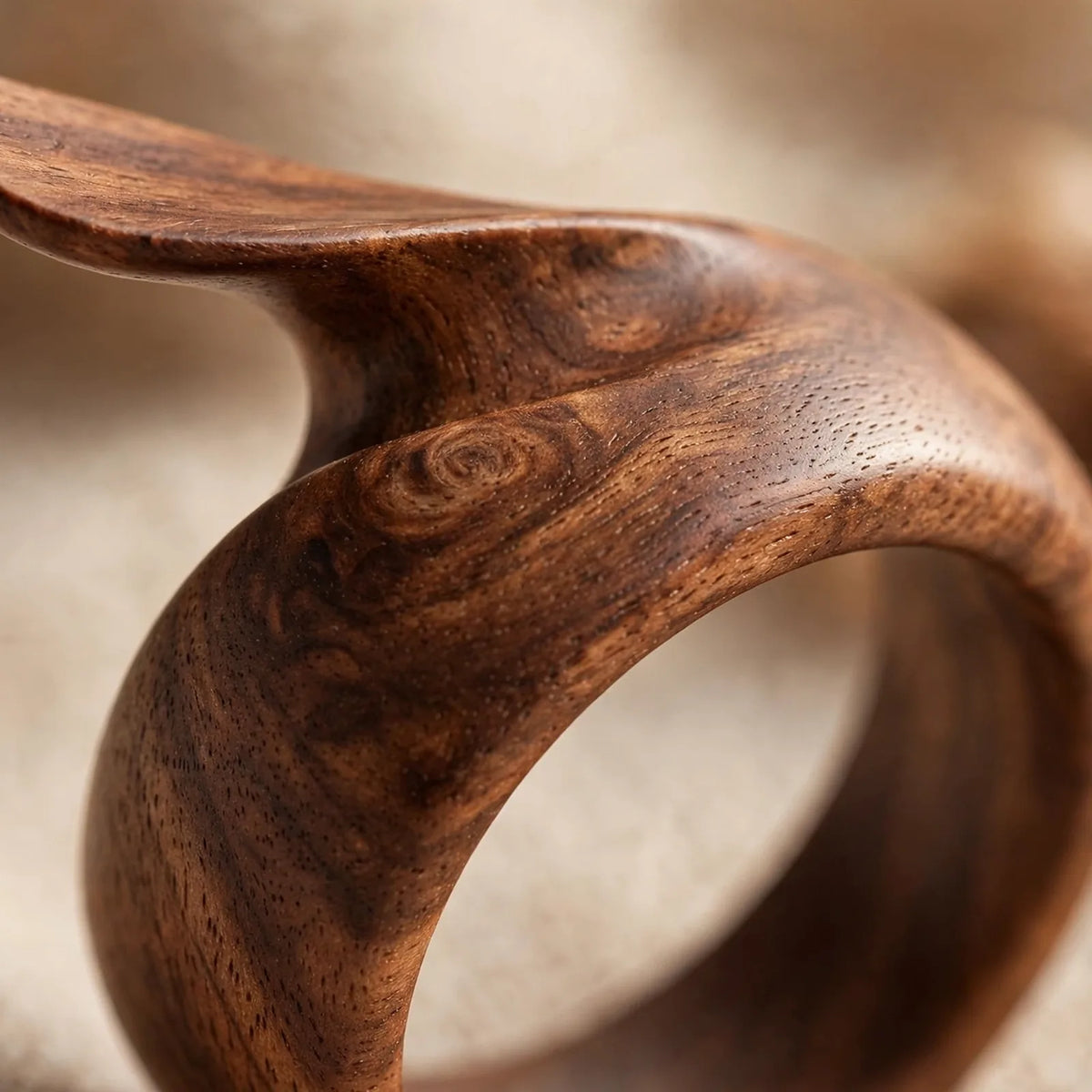 Close-up of natural walnut wood grain on thumb page holder ring